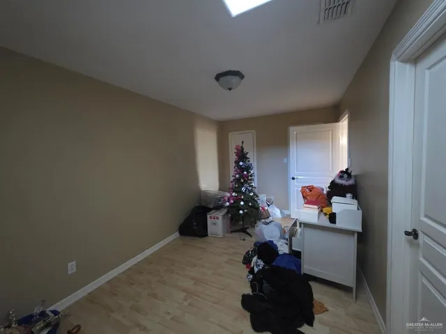 a room with furniture and a potted plant