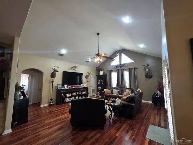 a living room with furniture and a flat screen tv