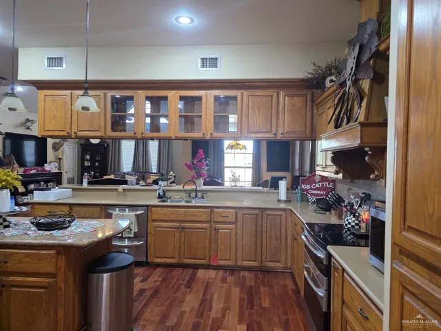a kitchen with lots of counter top space and a window