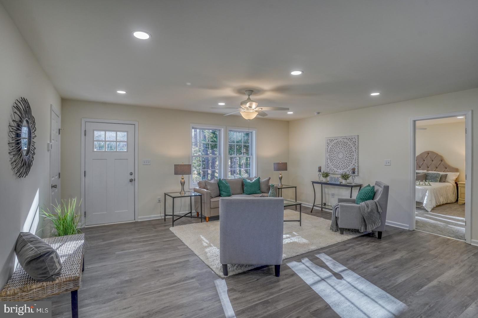4366 Deep Grass Lane Houston, DE 19954 - Photo 4 of 28 a living room with furniture and wooden floor