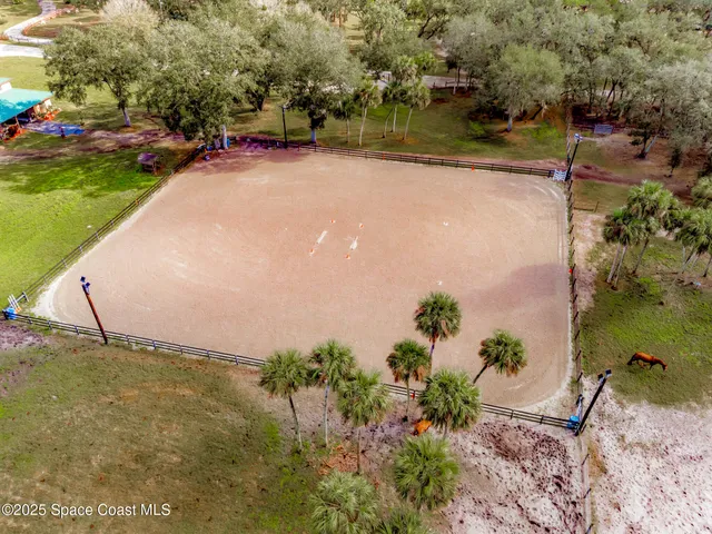 a view of a swimming pool with a yard