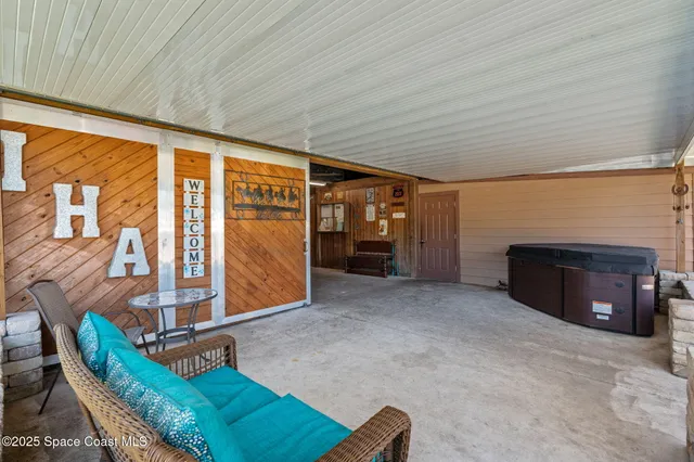 a view of a balcony with wooden floor
