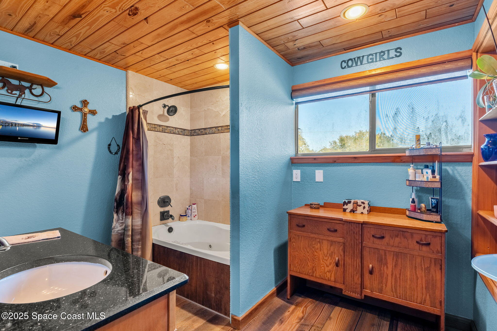 4630 James Road Cocoa, FL 32926 - Photo 37 of 58 a bathroom with a sink a mirror and a toilet