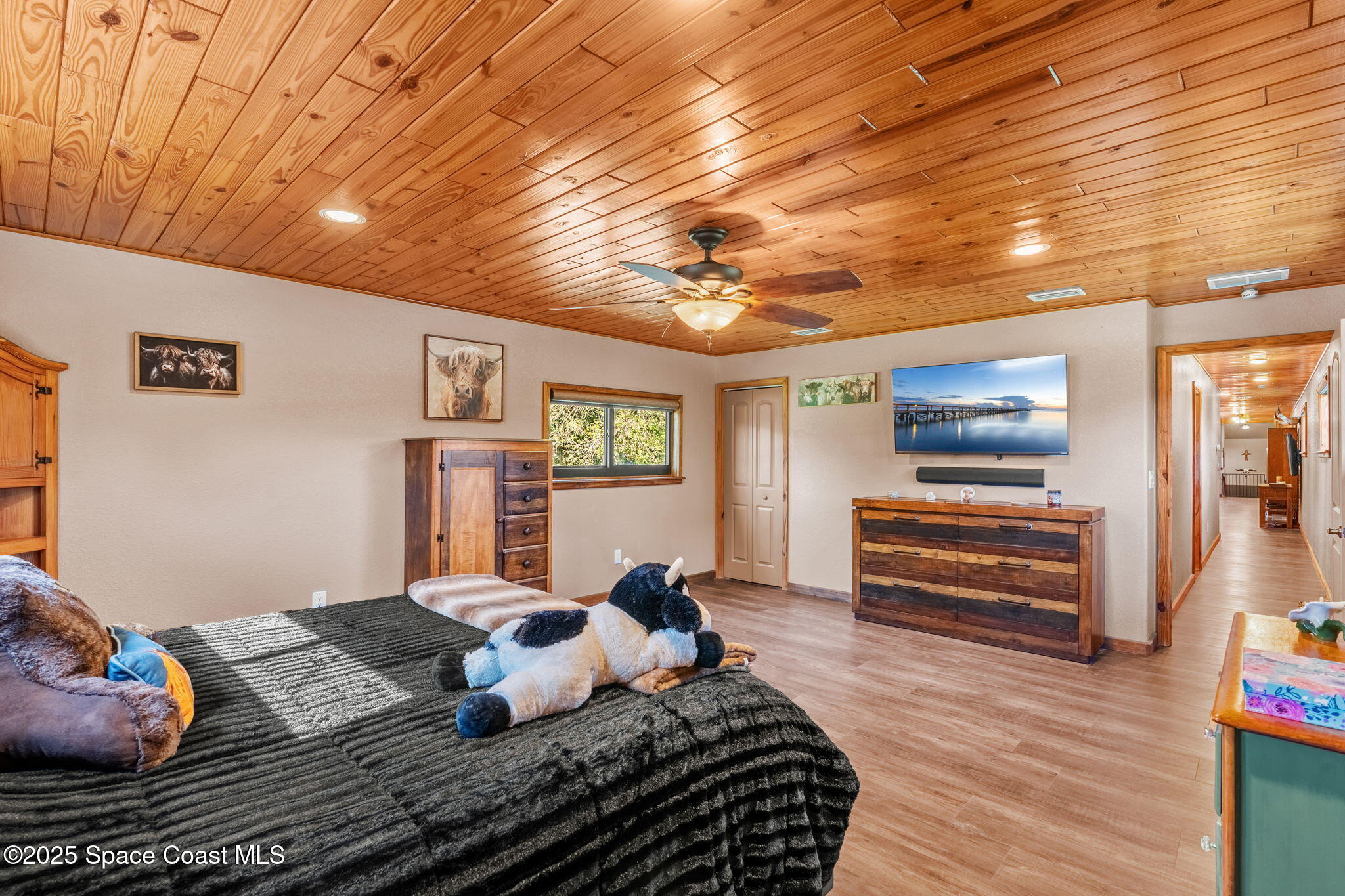 4630 James Road Cocoa, FL 32926 - Photo 40 of 58 a bedroom with a bed and wooden floor