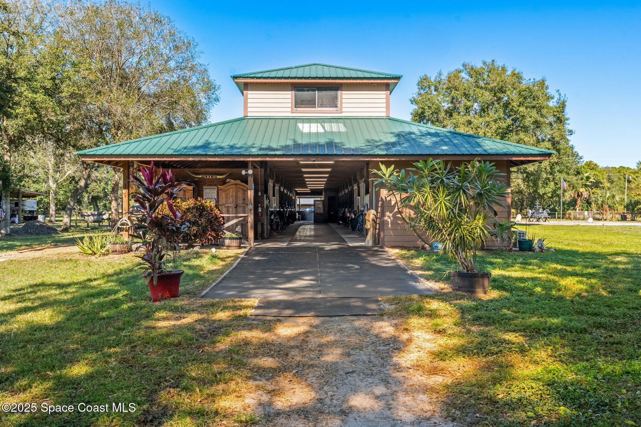 4630 James Road Cocoa, FL 32926 - Photo 4 of 58 a view of a house with backyard porch and sitting area