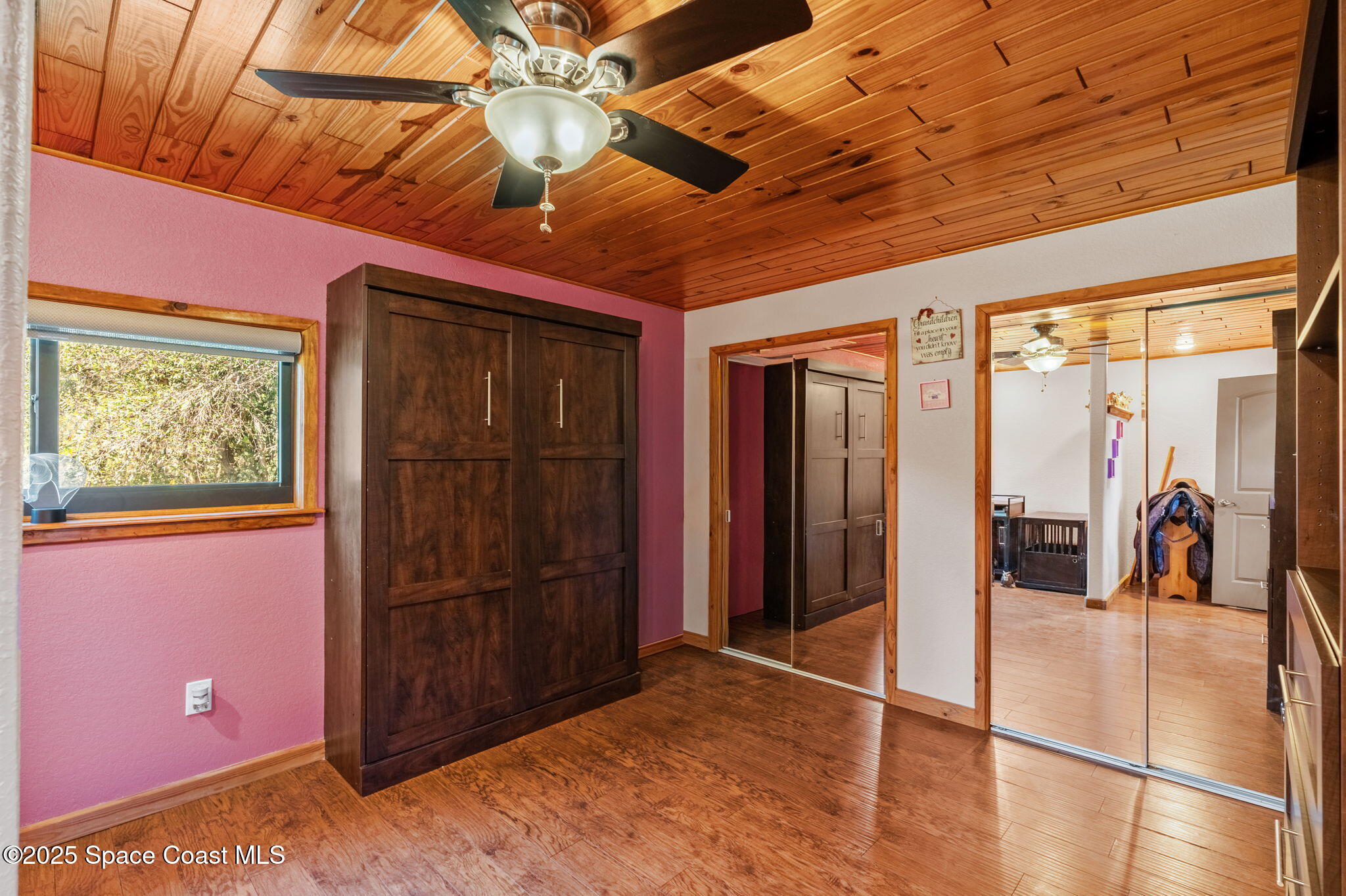4630 James Road Cocoa, FL 32926 - Photo 41 of 58 a view of a hallway with wooden floor and sliding door