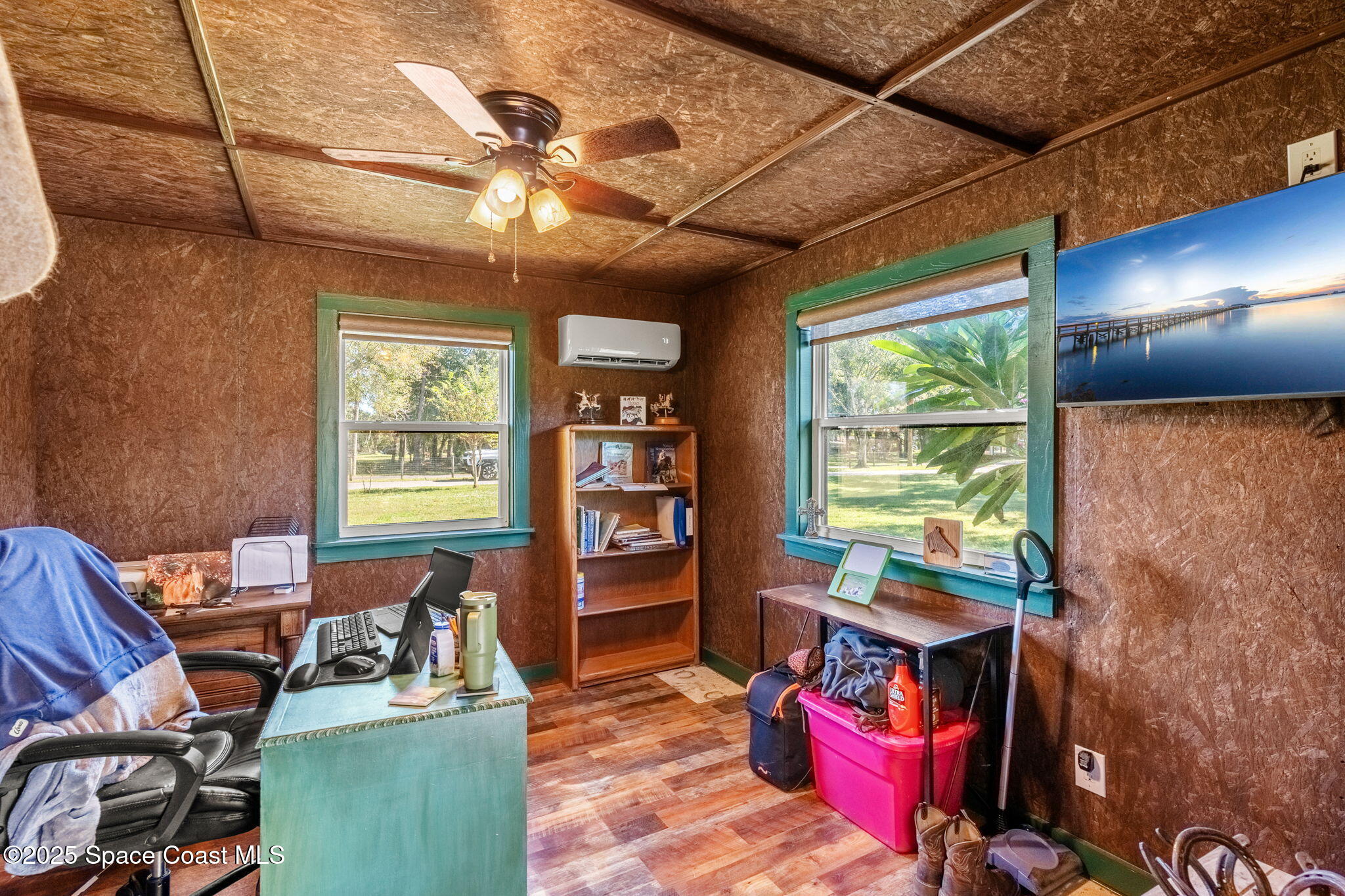 4630 James Road Cocoa, FL 32926 - Photo 43 of 58 a work room with furniture and a floor to ceiling window