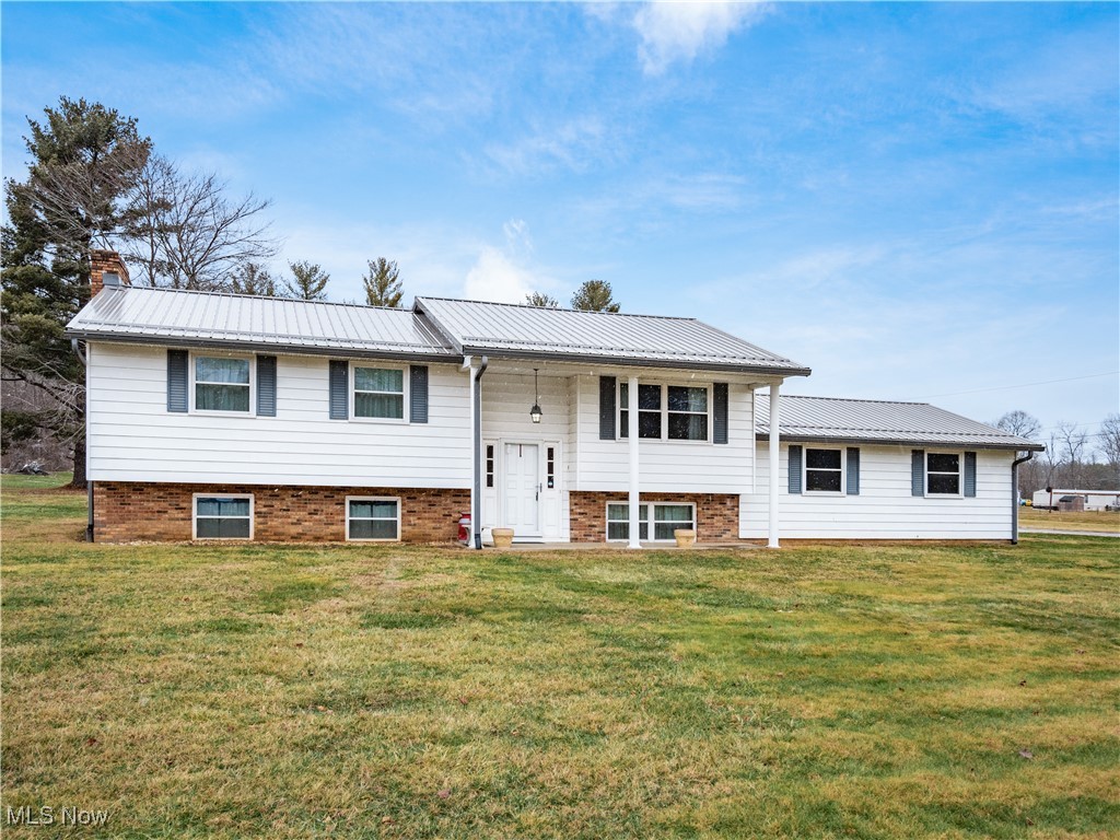 12454 Old Rainer Road Roseville, OH 43777 - Photo 1 of 33 Bi-level home featuring a front lawn