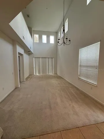 a view of an empty room with a balcony