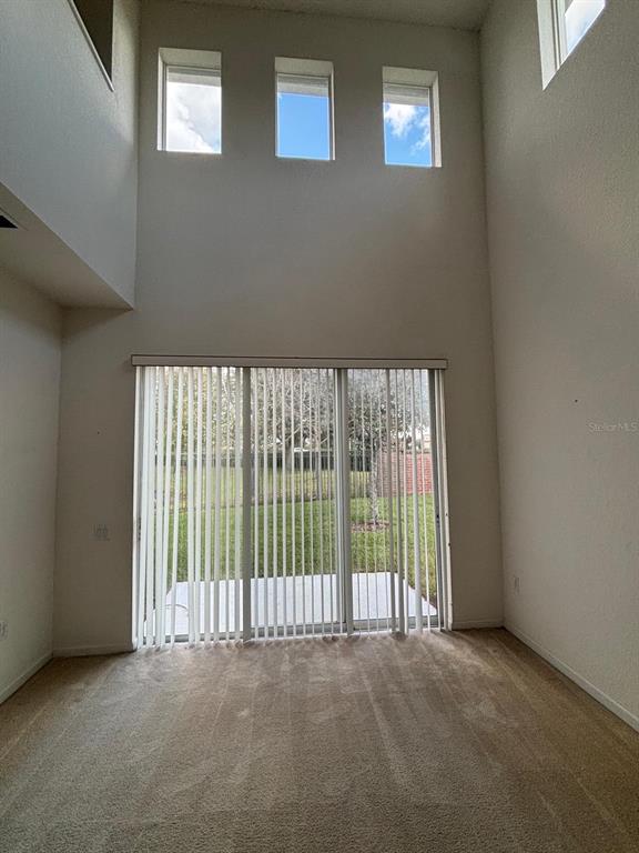 1215 Shallcross Avenue Orlando, FL 32828 - Photo 17 of 44 a view of an empty room with a balcony