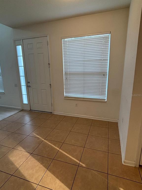 1215 Shallcross Avenue Orlando, FL 32828 - Photo 18 of 44 a view of an empty room with a window