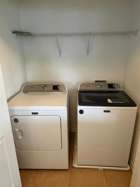 1215 Shallcross Avenue Orlando, FL 32828 - Photo 37 of 44 a utility room with dryer and washer