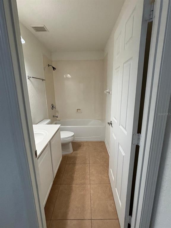 1215 Shallcross Avenue Orlando, FL 32828 - Photo 39 of 44 a bathroom with a sink a mirror and a bathtub