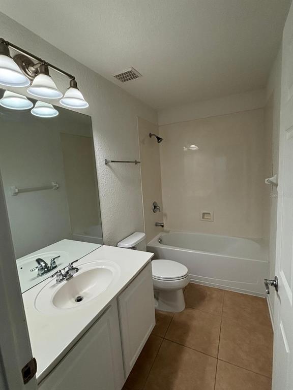 1215 Shallcross Avenue Orlando, FL 32828 - Photo 40 of 44 a bathroom with a sink a toilet and shower