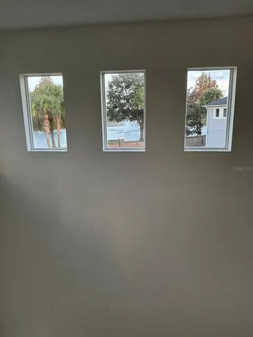 an empty room with windows