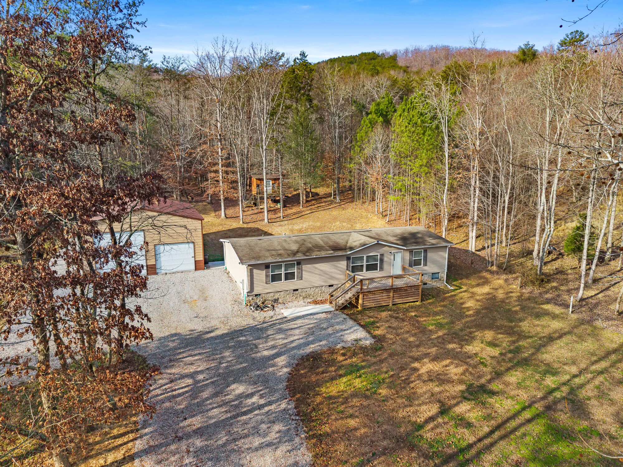 185 Bivens Road Tellico Plains, TN 37385 - Photo 11 of 34 a view of a house with a yard and sitting area