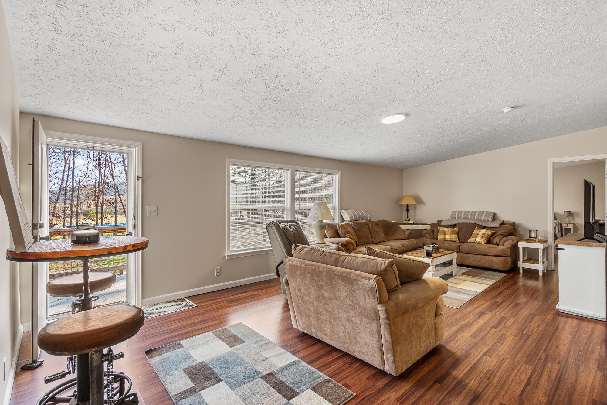 185 Bivens Road Tellico Plains, TN 37385 - Photo 14 of 34 a living room with furniture a window and a table
