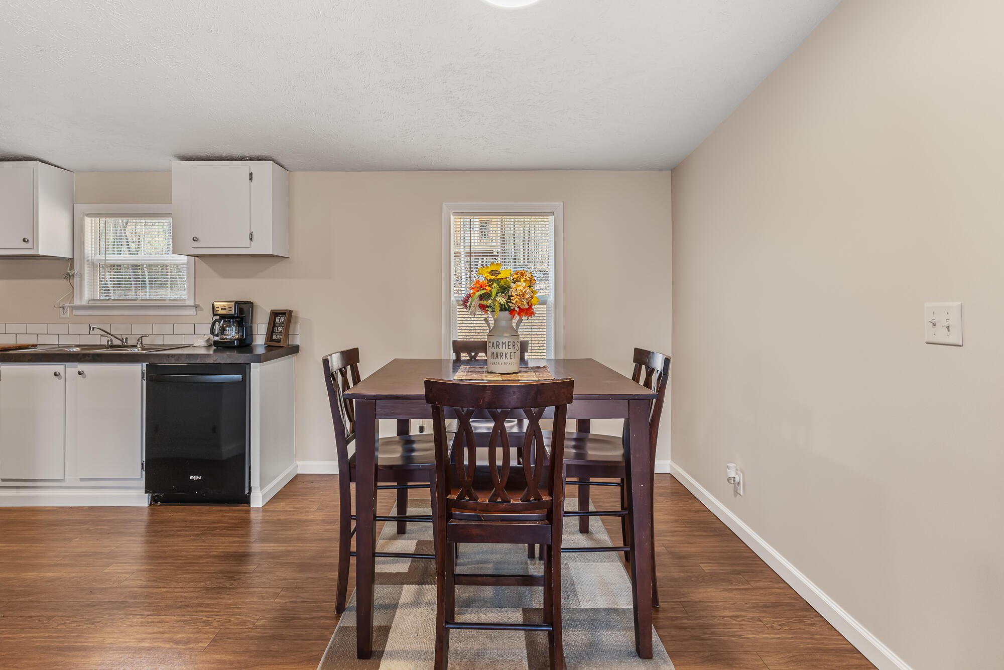 185 Bivens Road Tellico Plains, TN 37385 - Photo 20 of 34 a view of a dining room with furniture and wooden floor