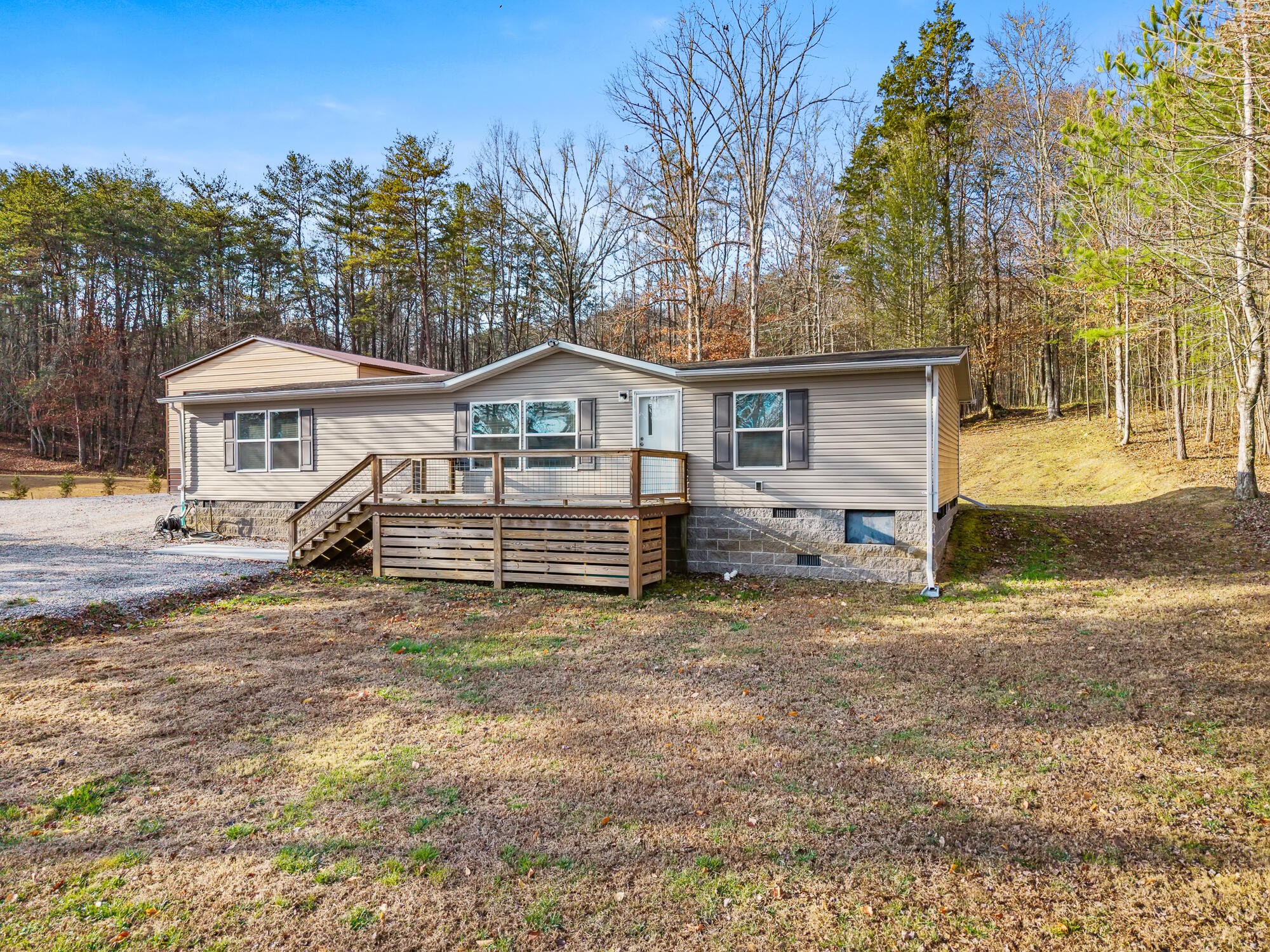 185 Bivens Road Tellico Plains, TN 37385 - Photo 2 of 34 a view of a house with a yard