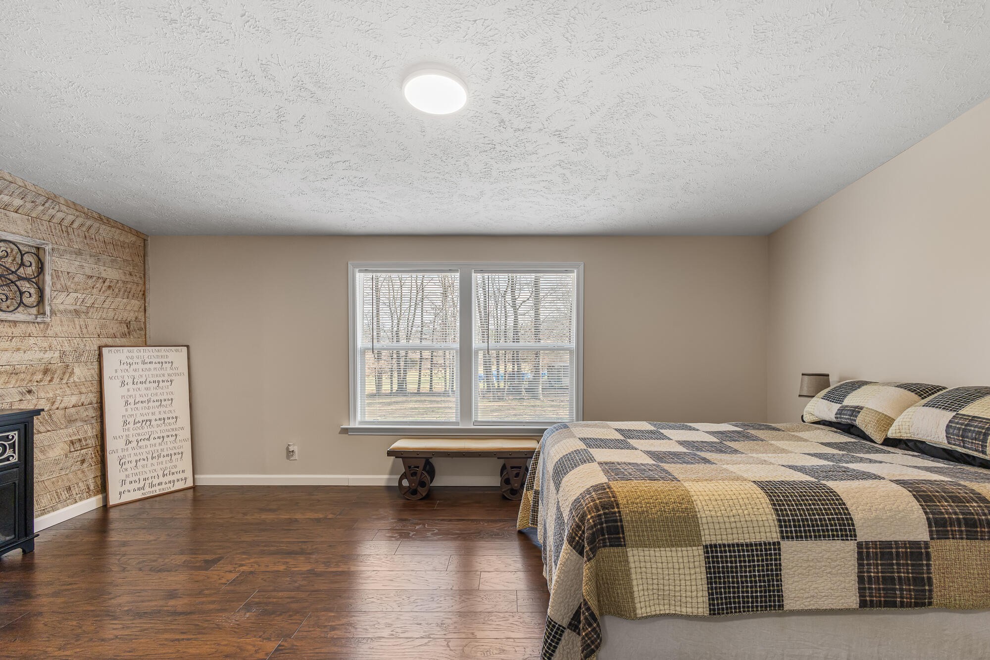 185 Bivens Road Tellico Plains, TN 37385 - Photo 24 of 34 a spacious bedroom with a bed and a window
