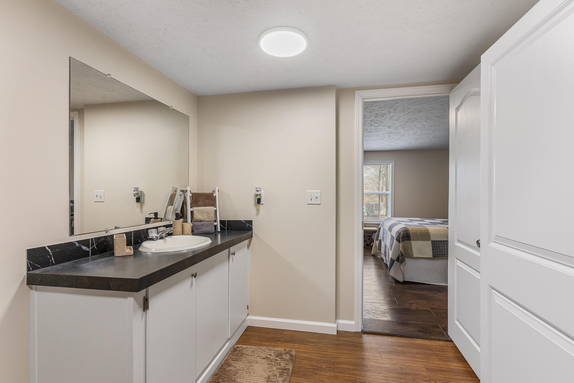 185 Bivens Road Tellico Plains, TN 37385 - Photo 27 of 34 a bathroom with a sink and a mirror