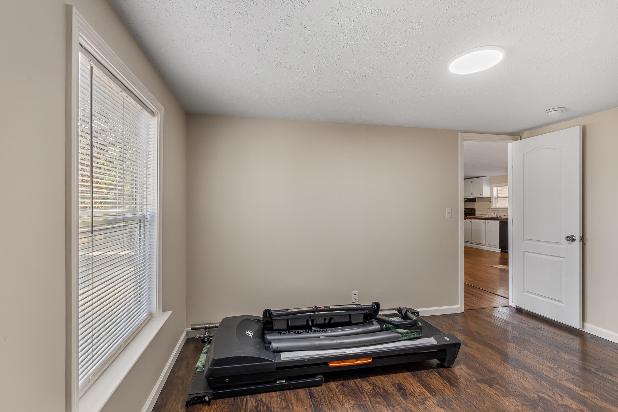 185 Bivens Road Tellico Plains, TN 37385 - Photo 30 of 34 a view of room with wooden floor and white walls