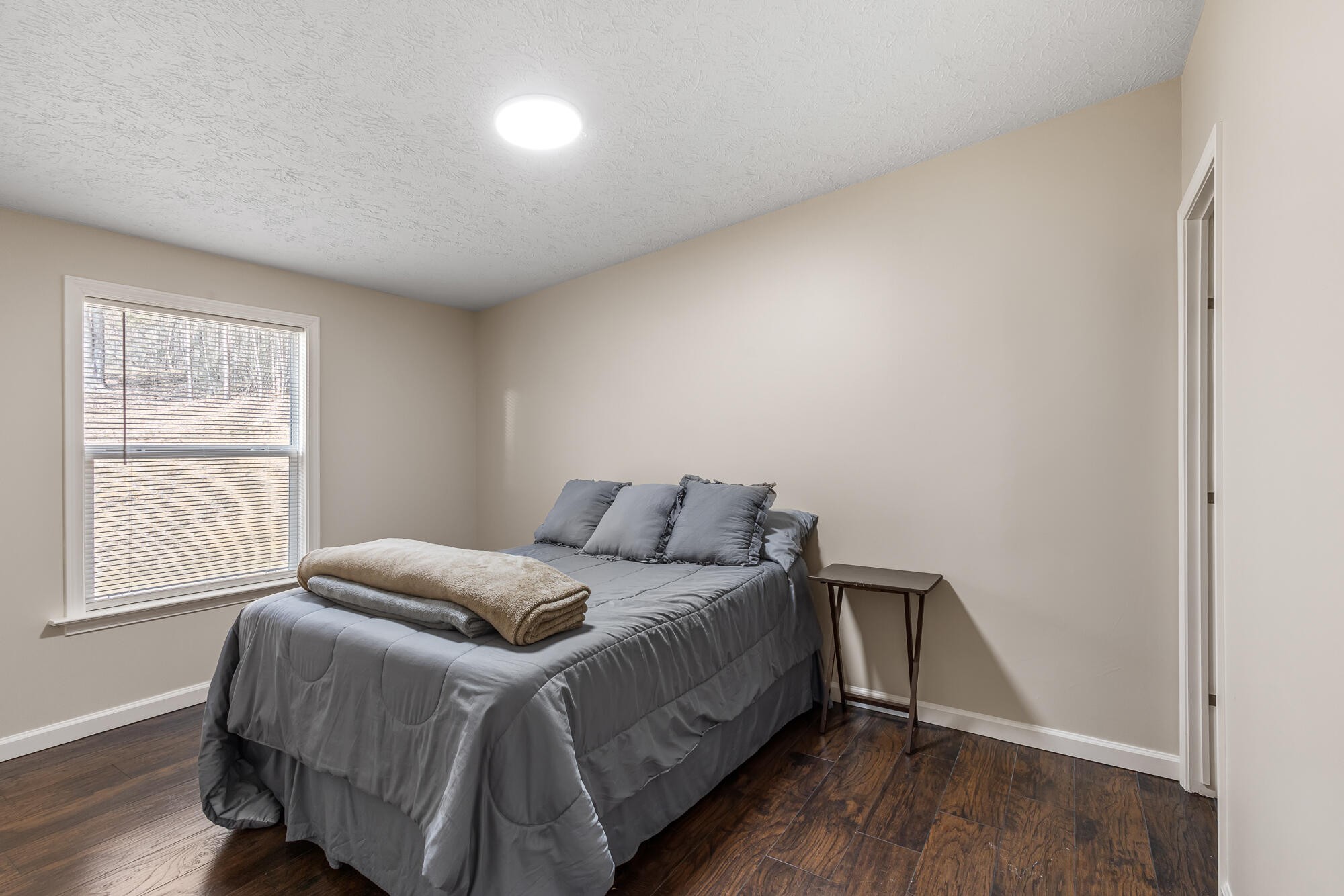 185 Bivens Road Tellico Plains, TN 37385 - Photo 31 of 34 a bedroom with a bed and a window
