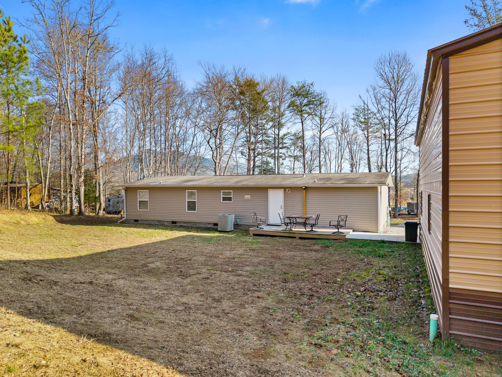 185 Bivens Road Tellico Plains, TN 37385 - Photo 6 of 34 a house with trees in front of it