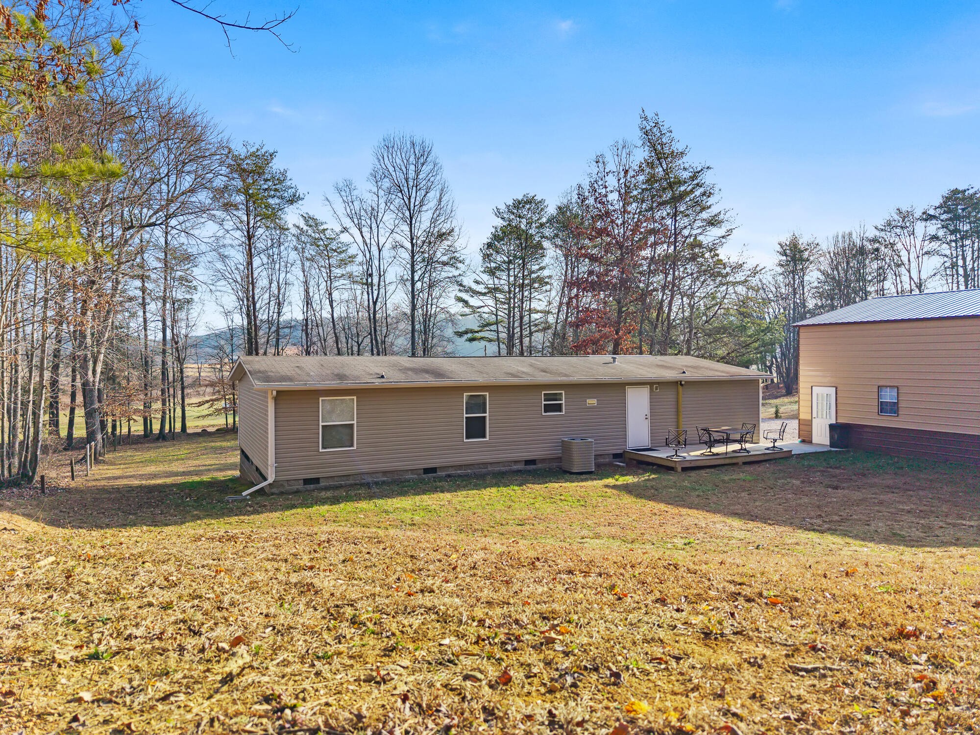 185 Bivens Road Tellico Plains, TN 37385 - Photo 7 of 34 a view of a house with a yard