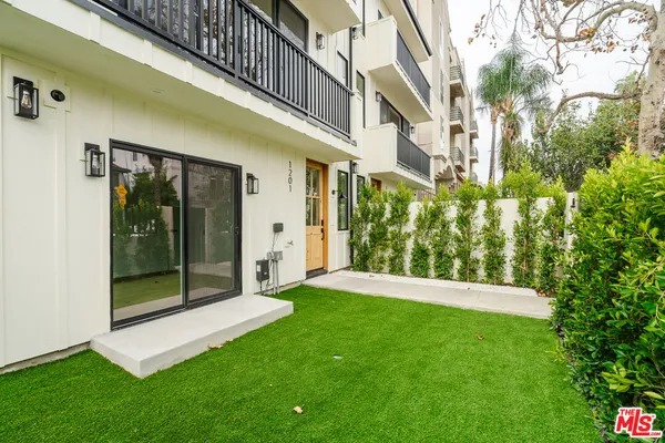 a view of an entryway with a garden