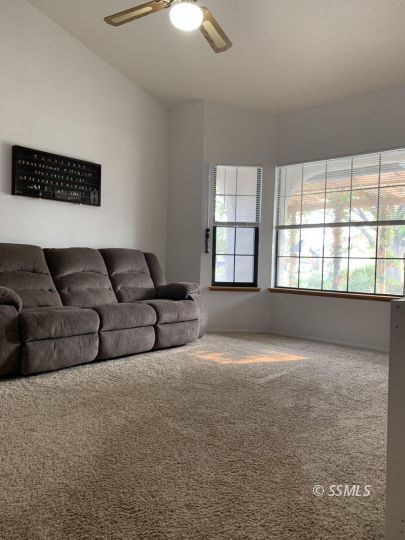 807 James Street Ridgecrest, CA 93555 - Photo 14 of 37 a living room with furniture and a large window