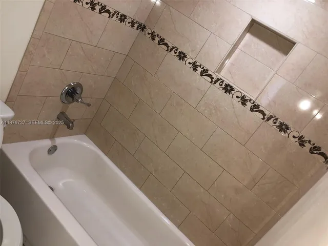 a bathroom with a sink and vanity