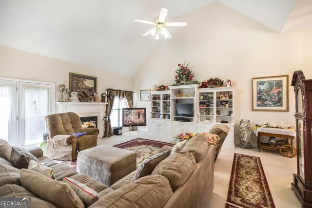 a bedroom with furniture and a flat screen tv