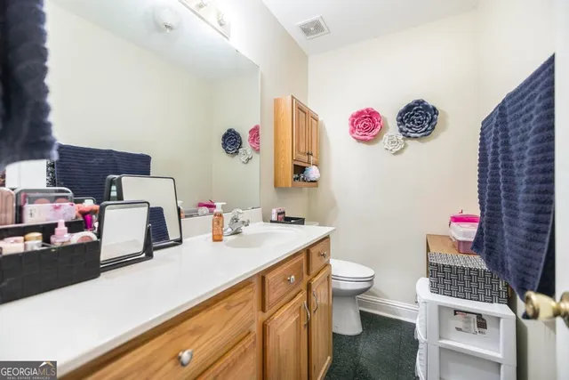 a bed room with a bed and a chandelier