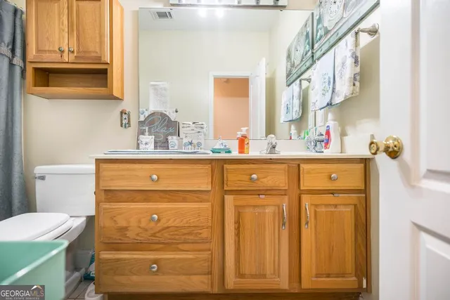 a bedroom with furniture and a window