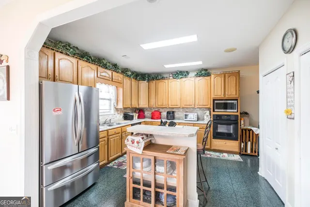 a kitchen with a stove and a sink