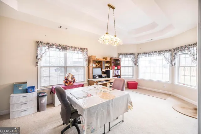 a bed room with a bed and a television