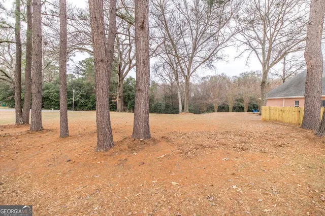 a view of a brick house with outdoor space