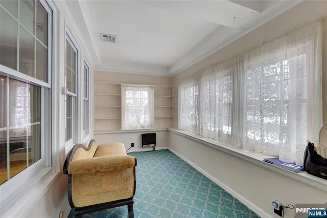 a lobby with furniture and windows