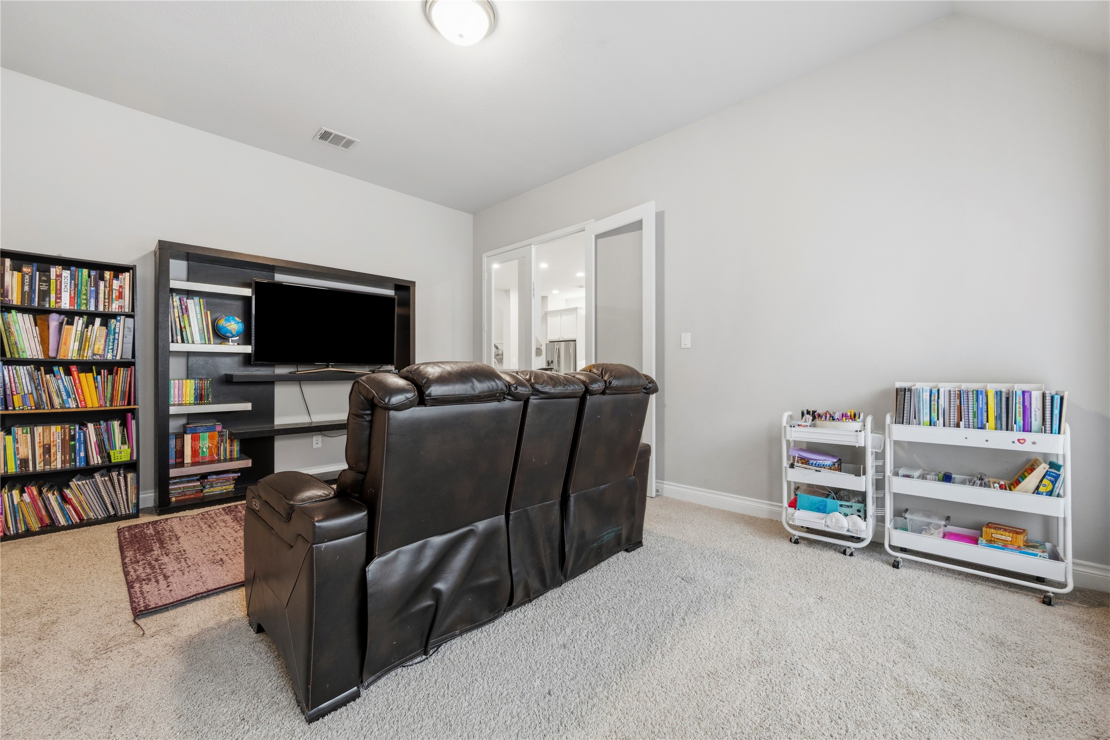 140 Catani Loop Georgetown, TX 78628 - Photo 24 of 36 Comfortable carpeted space perfect for a media room or quiet study.