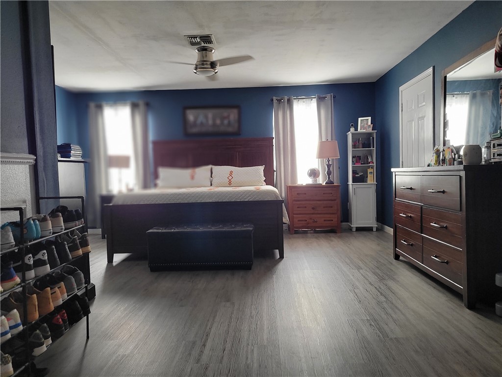4902 Marion Circle Corpus Christi, TX 78411 - Photo 19 of 27 a bedroom with a bed and a dresser