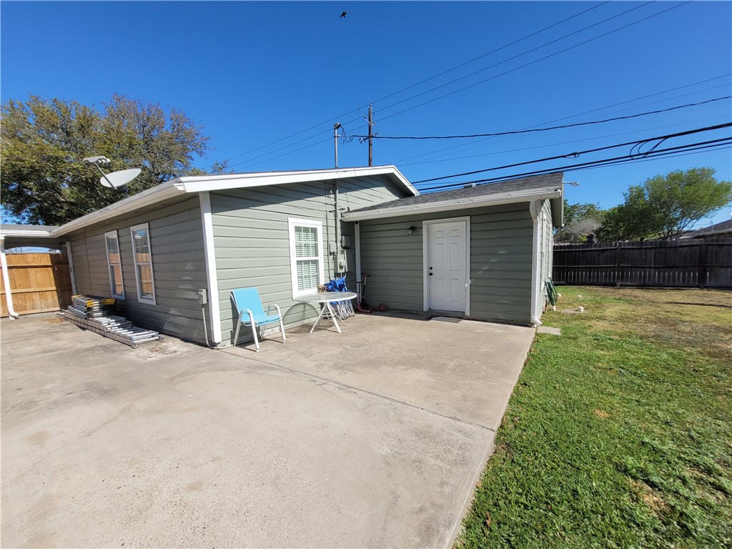 4902 Marion Circle Corpus Christi, TX 78411 - Photo 21 of 27 a view of a house with a yard and garage
