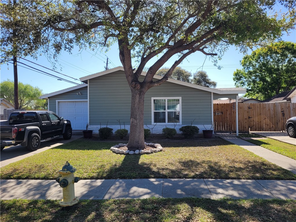 4902 Marion Circle Corpus Christi, TX 78411 - Photo 25 of 27 a view of a house with backyard swimming pool and sitting area