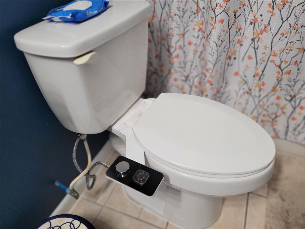 4902 Marion Circle Corpus Christi, TX 78411 - Photo 10 of 27 a bathroom with a toilet and a sink