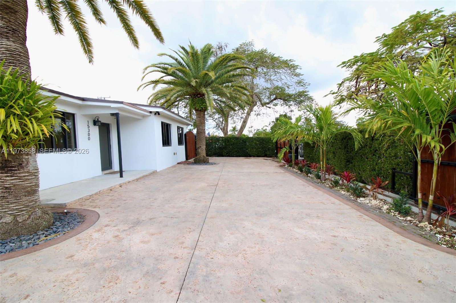 a view of a house with a yard and garage