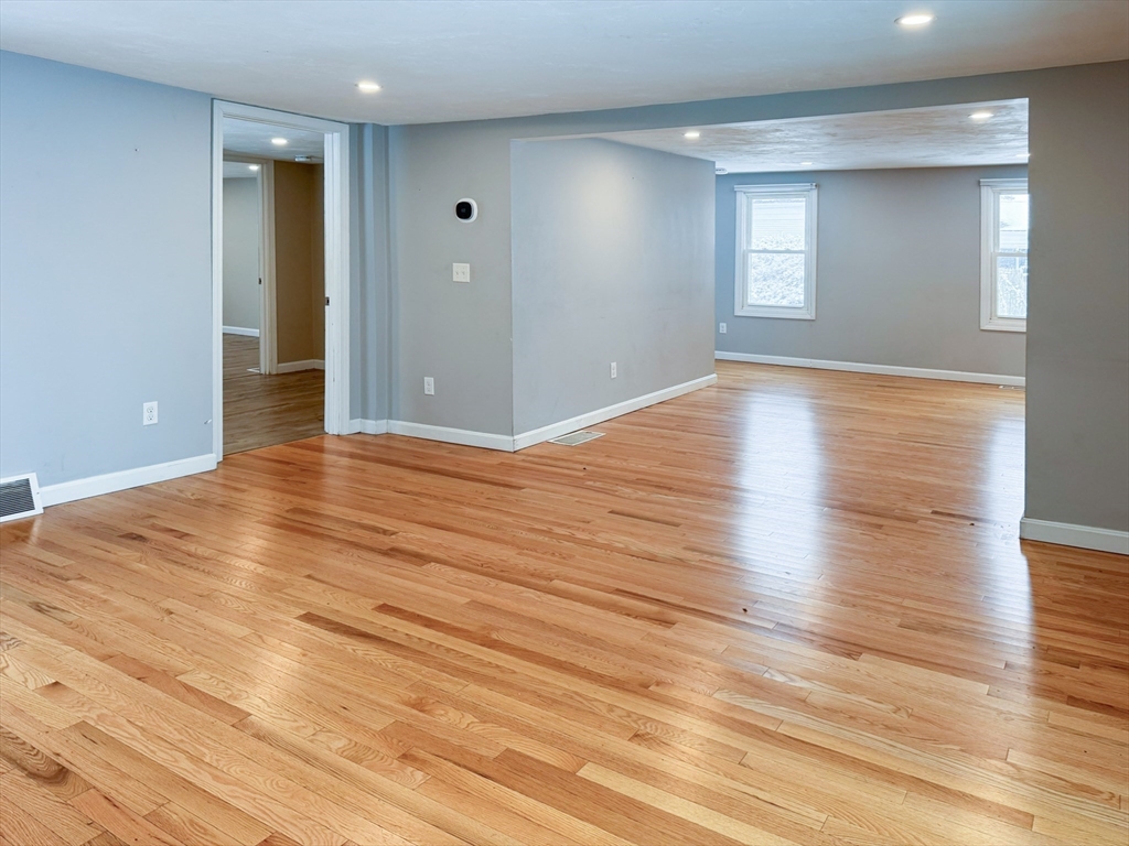 1 Chapel Lane Wareham, MA 02538 - Photo 14 of 29 an empty room with wooden floor and windows