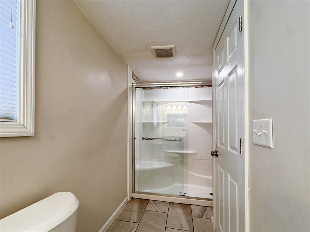 1 Chapel Lane Wareham, MA 02538 - Photo 19 of 29 a bathroom with a glass shower door
