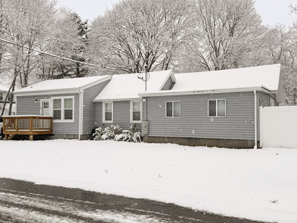 1 Chapel Lane Wareham, MA 02538 - Photo 2 of 29 a front view of a house with a yard covered with snow