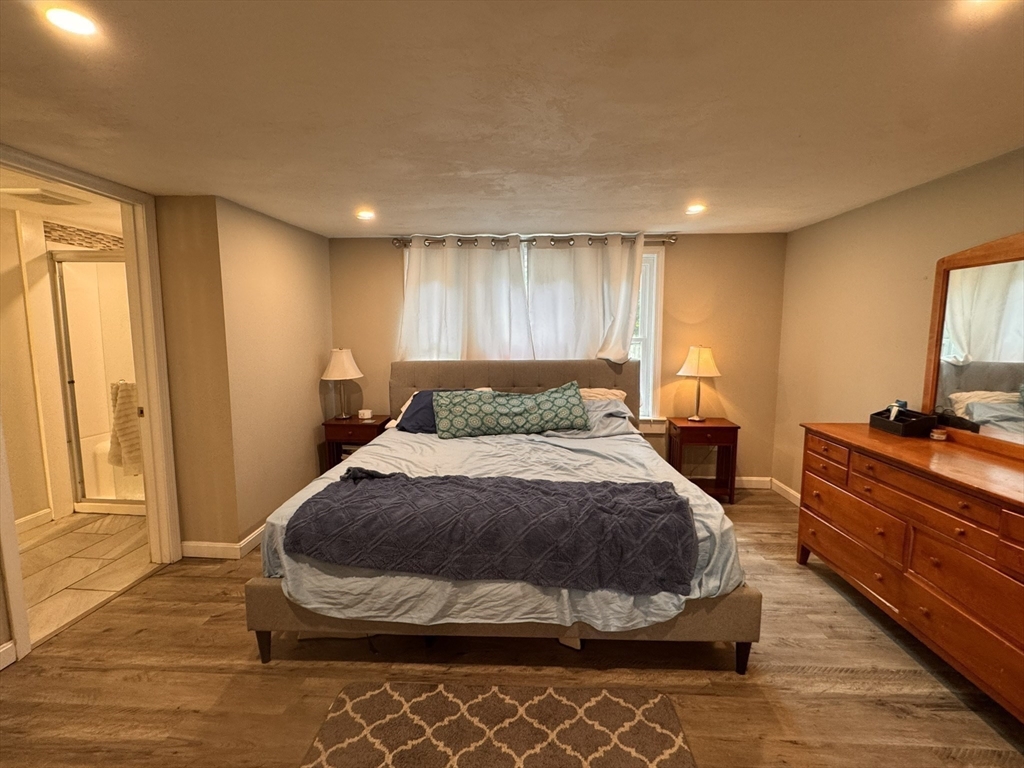 1 Chapel Lane Wareham, MA 02538 - Photo 23 of 29 a bedroom with a bed and wooden floor