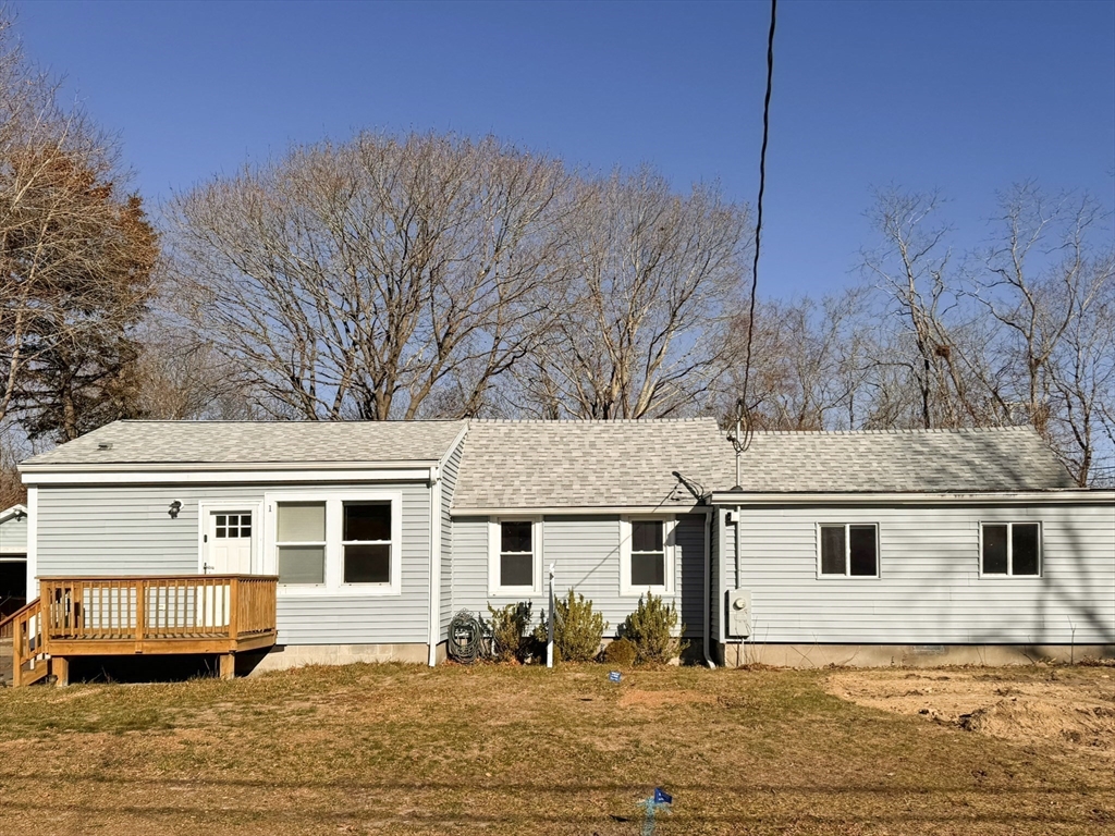 1 Chapel Lane Wareham, MA 02538 - Photo 3 of 29 a front view of a house with a yard